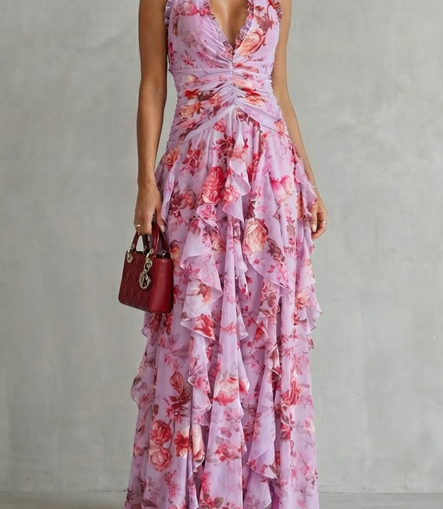 Lilac floral halter maxi dress with deep v-neck and ruched waist, layered ruffle skirt front view