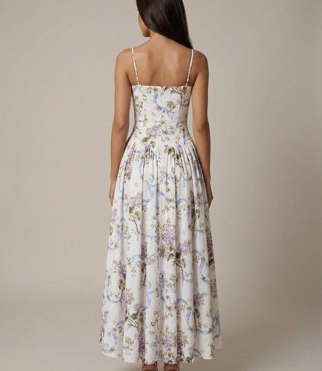 Back view of ivory floral corset midi dress with thin straps and full gathered skirt