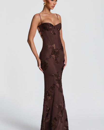 Chocolate brown lace maxi dress angled side view showing fitted silhouette and floral lace
