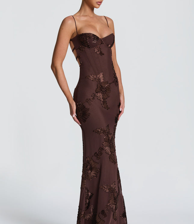 Chocolate brown lace maxi dress angled side view showing fitted silhouette and floral lace