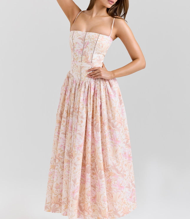 Side pose of blush floral corset midi dress highlighting fitted bodice and gathered skirt