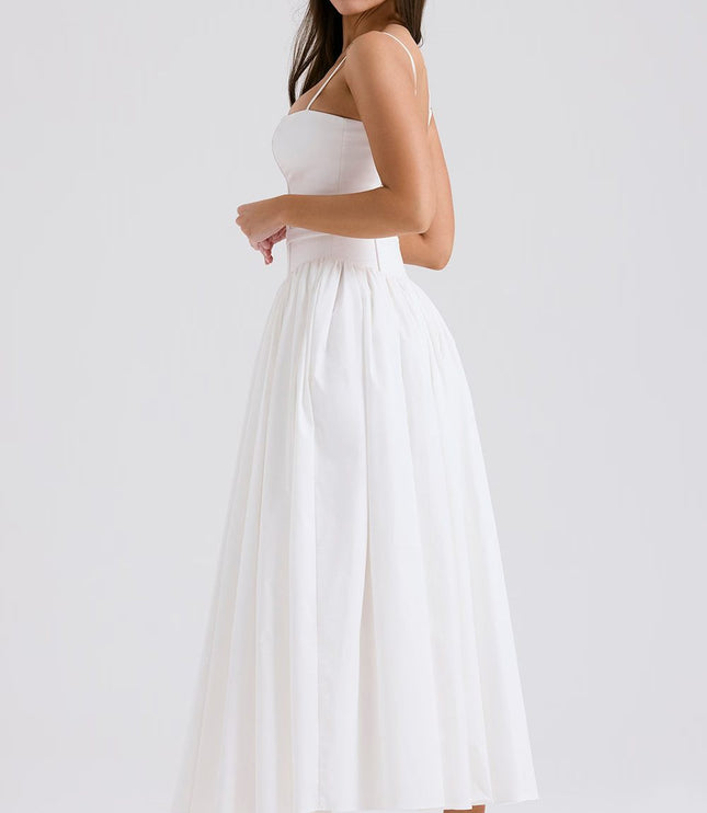 Side view of white corset midi dress with fitted bodice and voluminous gathered skirt