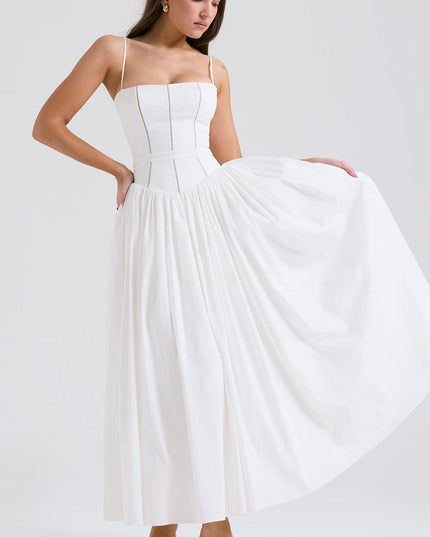 White corset midi dress with full skirt held out to show volume and drape, angled view