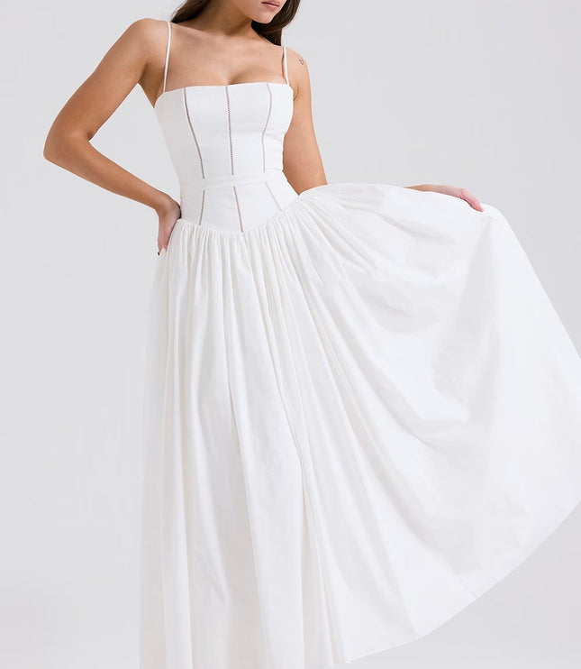 White corset midi dress with full skirt held out to show volume and drape, angled view