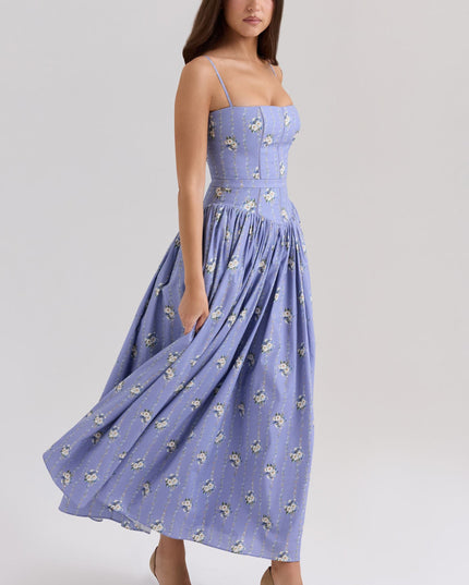 Periwinkle blue floral corset midi dress with spaghetti straps and flowing skirt, side view