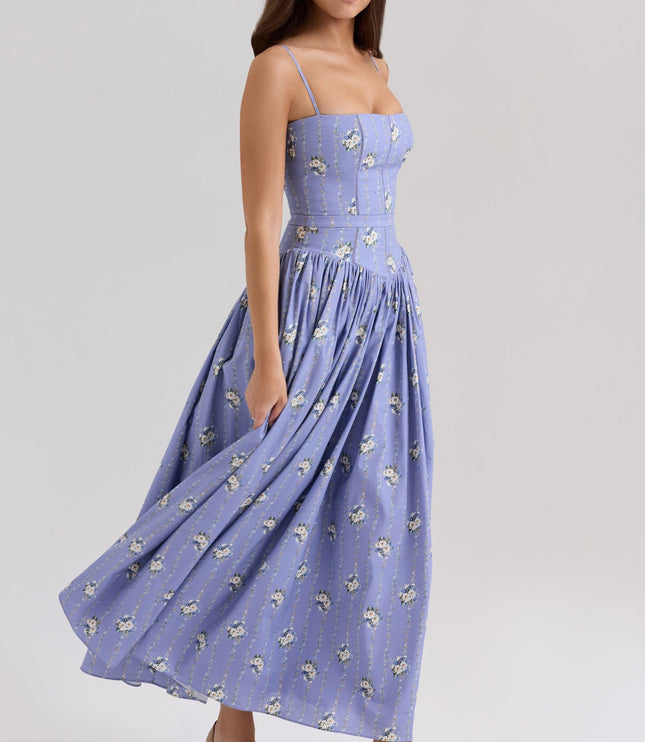 Periwinkle blue floral corset midi dress with spaghetti straps and flowing skirt, side view