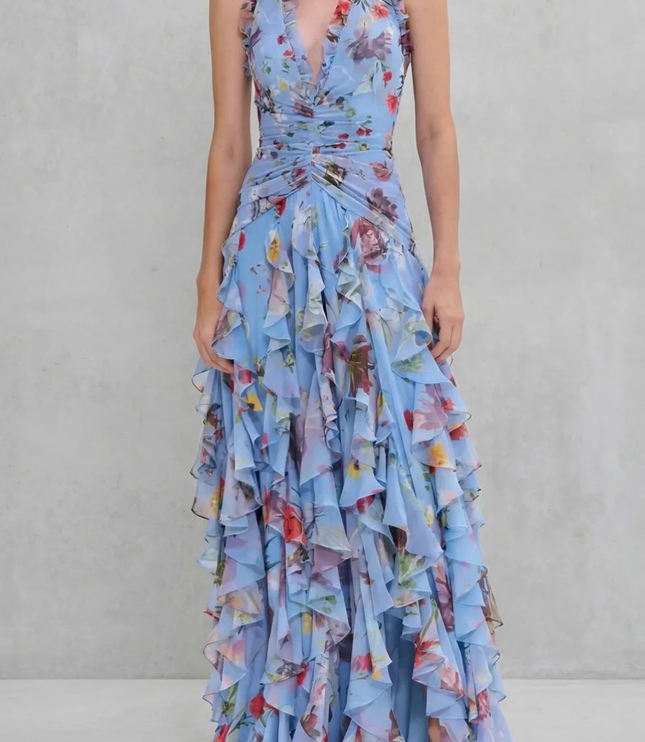 Light blue floral halter maxi dress with plunging v-neck, ruched waist, and dramatic ruffle skirt front