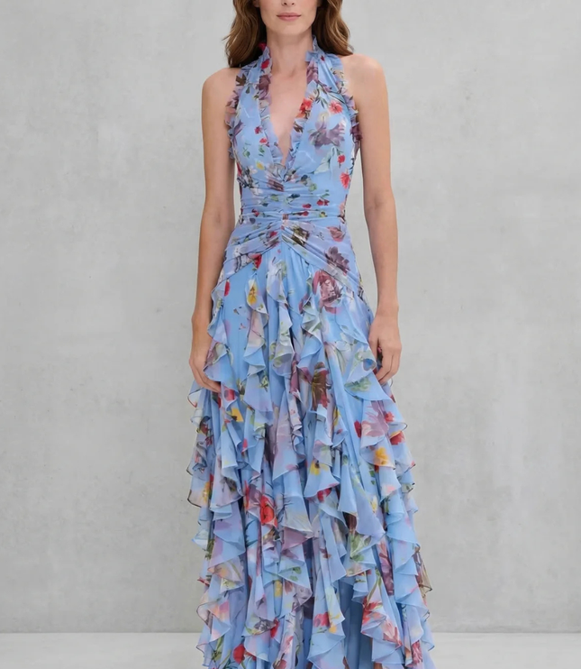 Front view of light blue floral halter maxi dress with ruffled trim neckline and tiered chiffon skirt