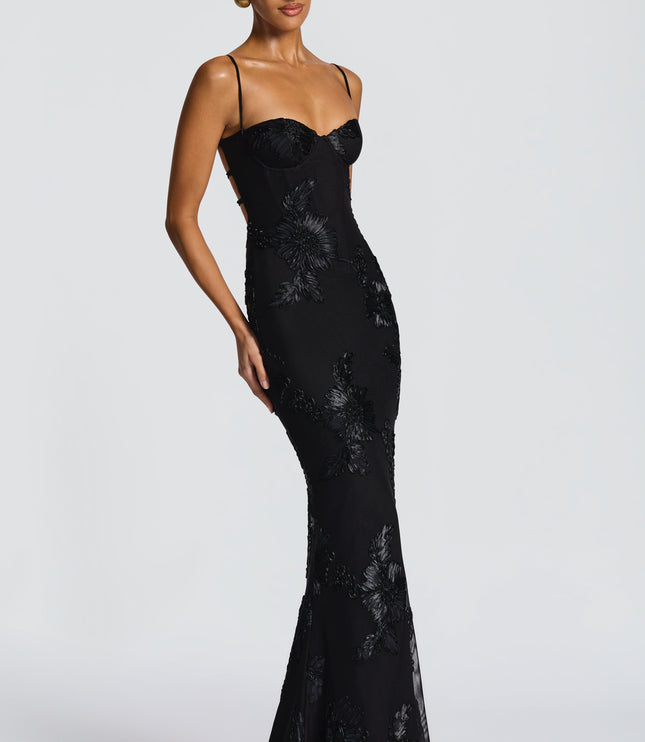 Black floral lace maxi dress with thin straps and bustier bodice, angled side view
