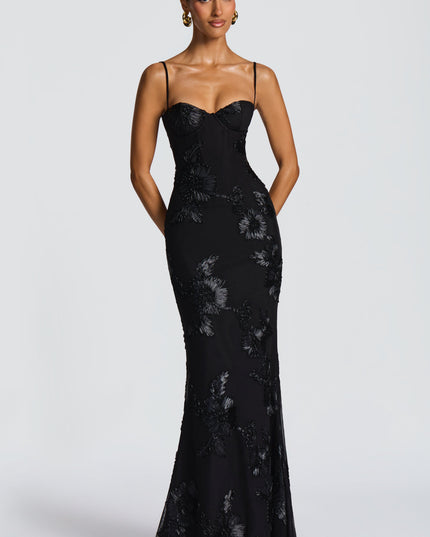 Black lace maxi dress with floral appliqué and sweetheart bustier neckline, front view