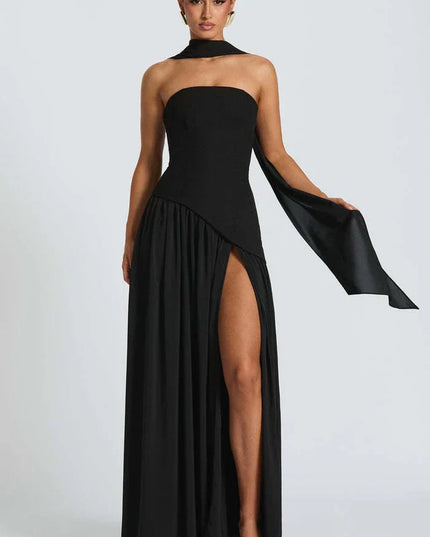 Black halter maxi dress with strapless neckline, high side slit, and long draped scarf
