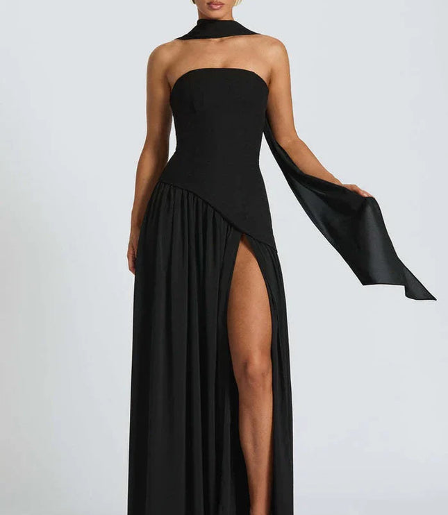 Black halter maxi dress with strapless neckline, high side slit, and long draped scarf