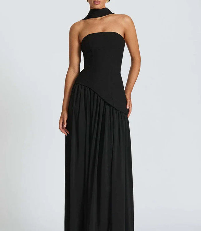 Front view of black halter maxi dress with fitted bodice and floor-length flowing skirt