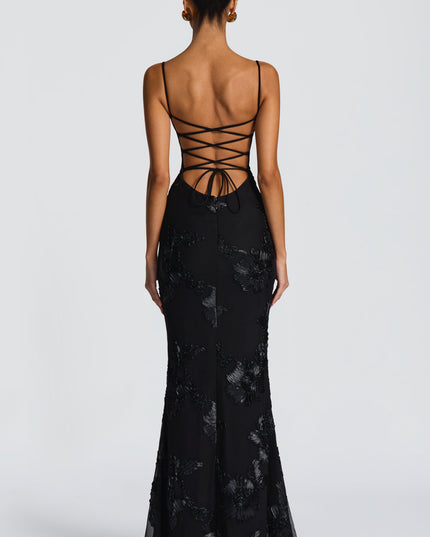 Black lace maxi dress back view with crisscross lace-up straps and fitted mermaid skirt