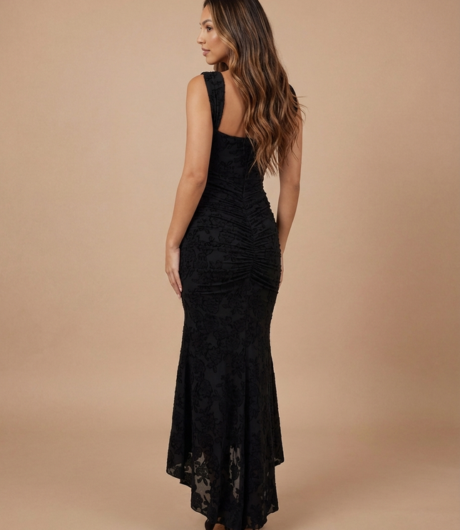 Black lace midi dress back three-quarter view with gathered center back ruching and high-low skirt