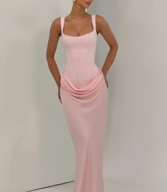 Blush pink corset maxi dress front view with draped skirt and straps