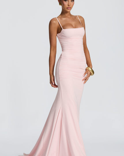 Blush pink maxi dress back view with lace-up open back and ruched skirt detail, summer dress