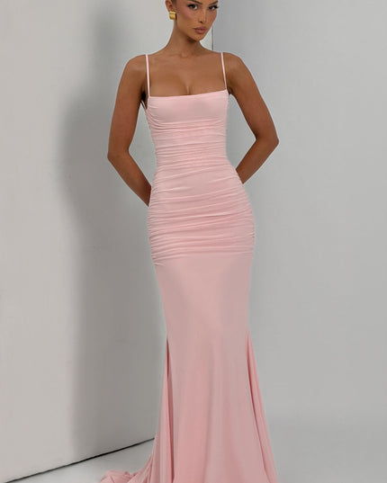 Closeup of blush pink ruched bodice on spaghetti strap maxi dress with straight neckline detail