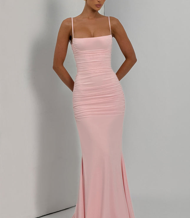 Blush pink ruched maxi dress full length front in studio, fitted bodycon style with floor train