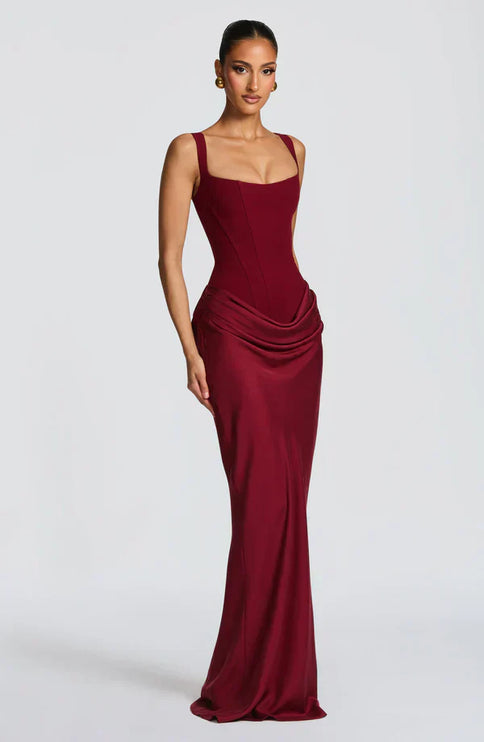 Burgundy square neck corset maxi dress shown at a slight angle with fitted skirt