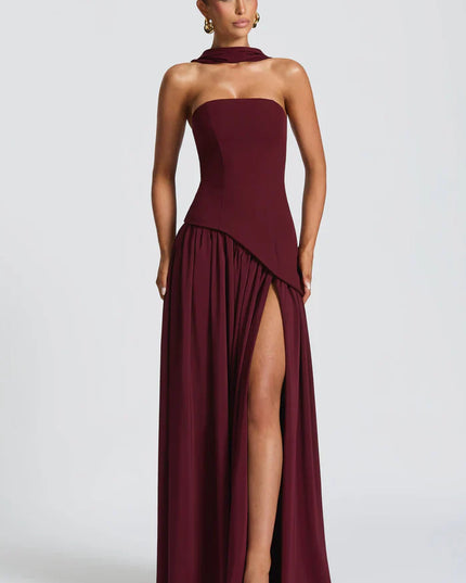 Front view of burgundy halter maxi dress with thigh slit and flowing skirt