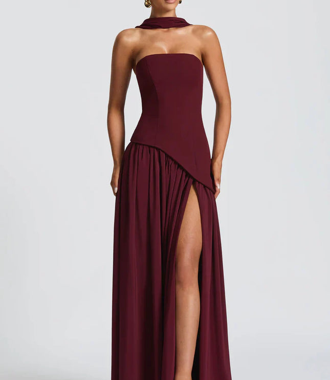 Front view of burgundy halter maxi dress with thigh slit and flowing skirt