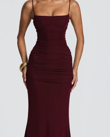 Burgundy ruched maxi dress three-quarter view highlighting fitted bodice and smooth skirt, maxi dress