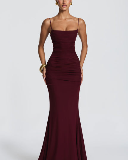 Burgundy ruched maxi dress with spaghetti straps and straight neckline, front view formal dress
