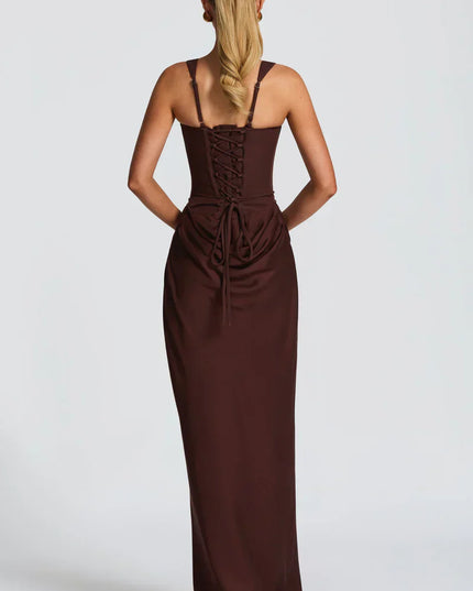 Side angle of chocolate brown square neck corset maxi dress with fitted silhouette and draped skirt