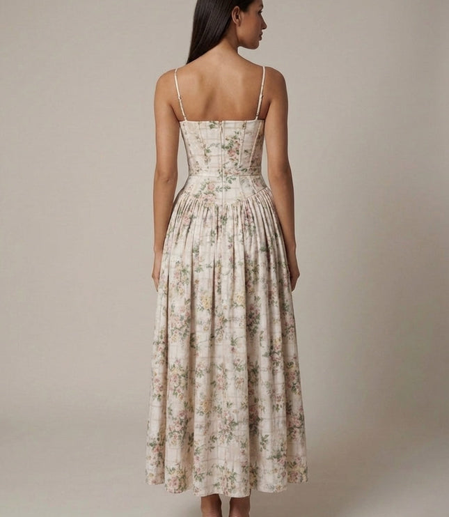 Back view of cream floral corset midi dress with thin straps and gathered skirt silhouette