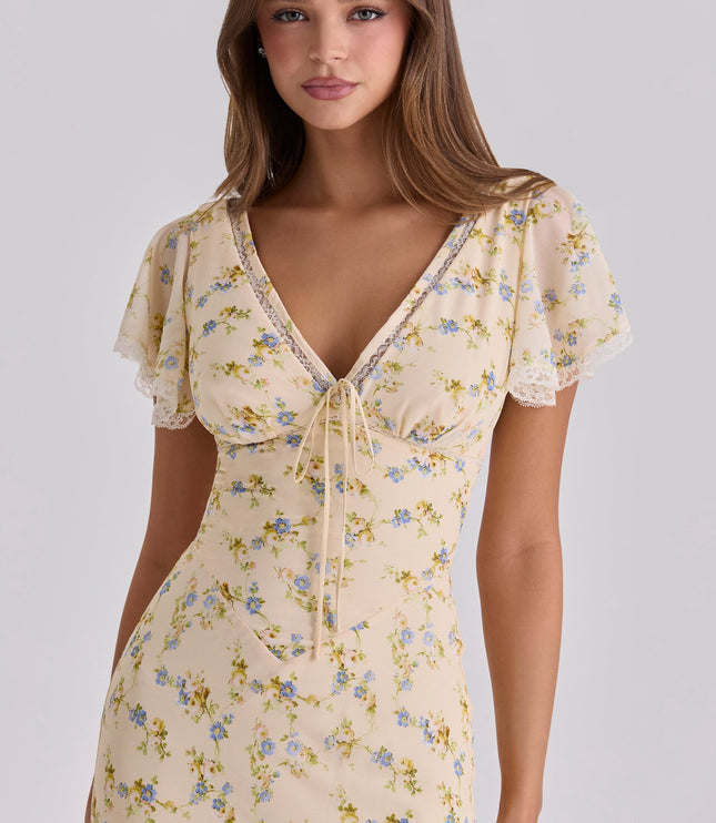 Cream floral lace v-neck maxi dress close-up with sheer flutter sleeves and tie-front neckline