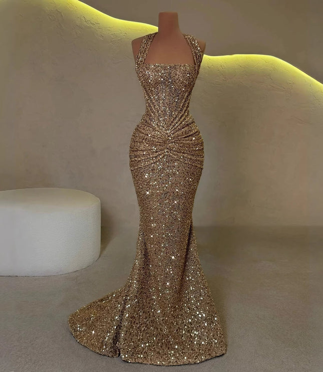 Gold sequin halter maxi dress displayed on a mannequin with draped skirt and halter straps, back view