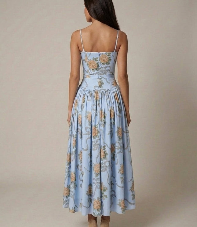 Back view of light blue floral corset midi dress with fitted waist and gathered skirt