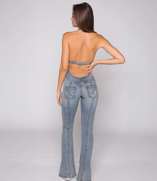 Rear view of a light blue halter denim jumpsuit with open back and flared legs
