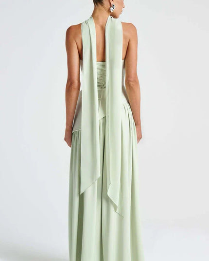 Back view of light green halter maxi dress with long scarf ties and lace-up bodice