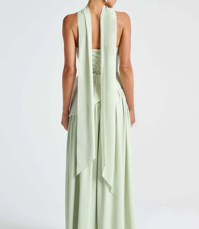 Back view of light green halter maxi dress with long scarf ties and lace-up bodice