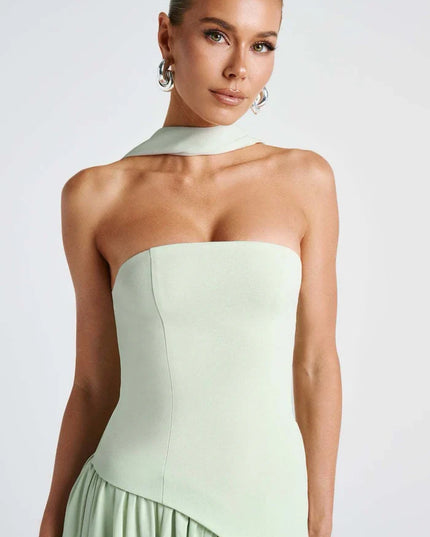 Light green halter maxi dress with strapless bodice, scarf neck tie, and draped skirt