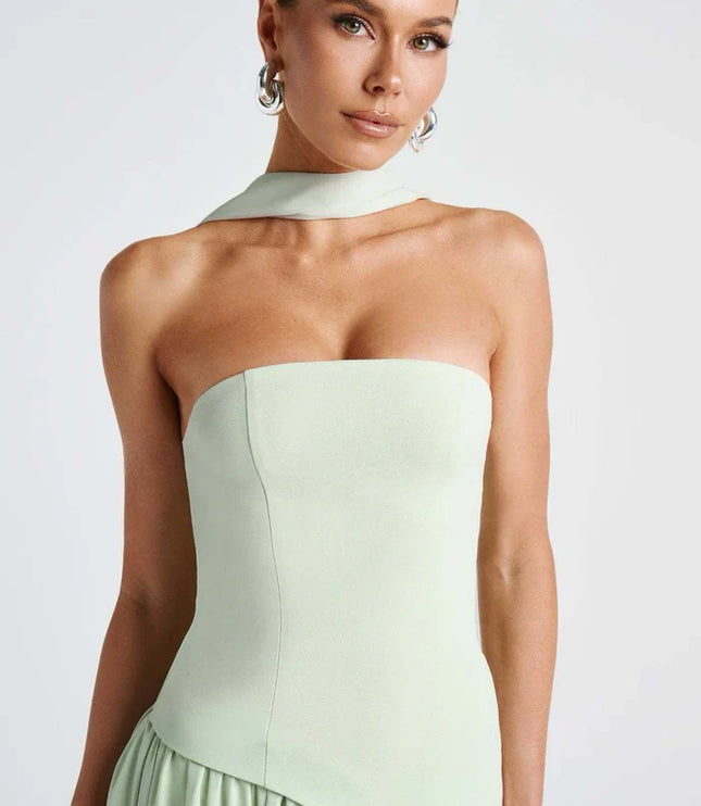 Light green halter maxi dress with strapless bodice, scarf neck tie, and draped skirt