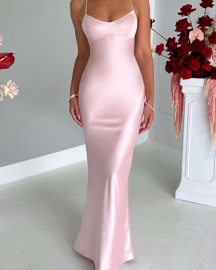 Full front view of the elegant pink satin maxi dress, highlighting its flowing silhouette and delicate straps.
