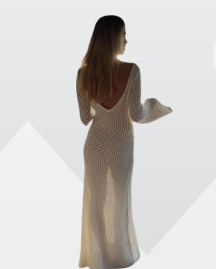 Back view of a white long sleeve crochet maxi dress with a low scoop back, highlighting the garment's fit.