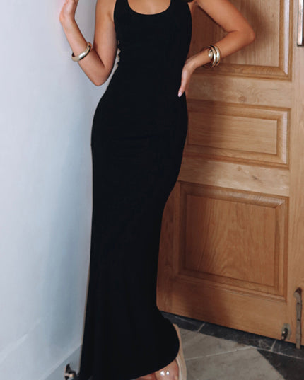 Full-length view of the black halter scoop neck maxi dress, showing its elegant flow and versatile style for various occasions.