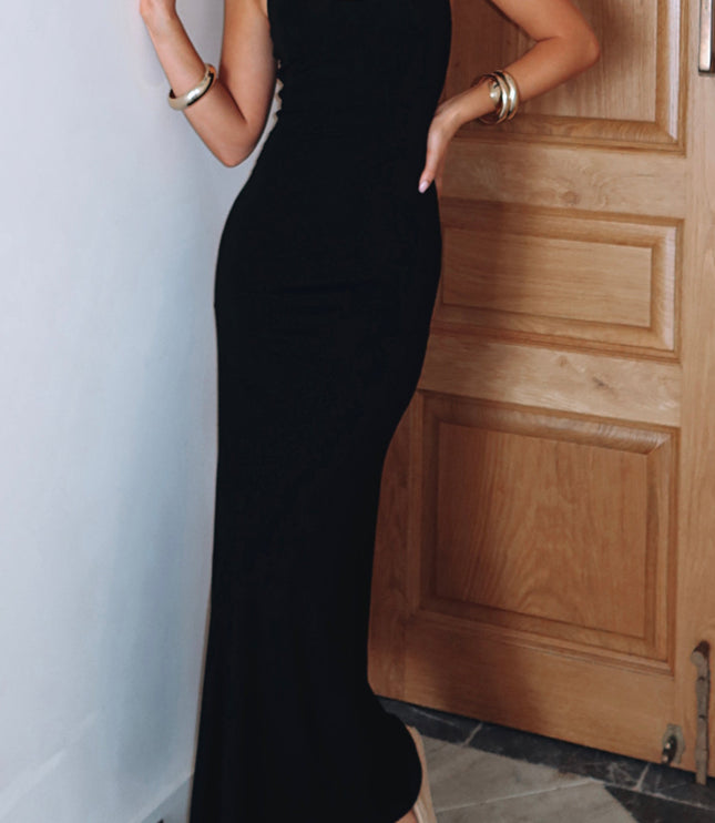Full-length view of the black halter scoop neck maxi dress, showing its elegant flow and versatile style for various occasions.