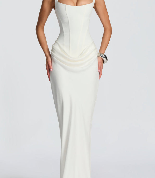Full length view of a sophisticated white women's maxi dress with a square neckline, structured corset, and soft draping.