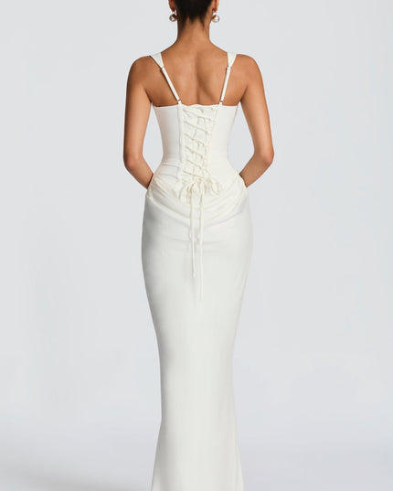 Back view of the white square neck corset maxi dress, showcasing the lace-up corset detail on the back.