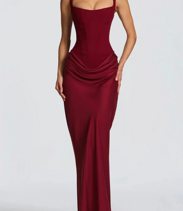 Elegant burgundy square neck corset maxi dress for women, featuring a draped waist and flowing skirt.