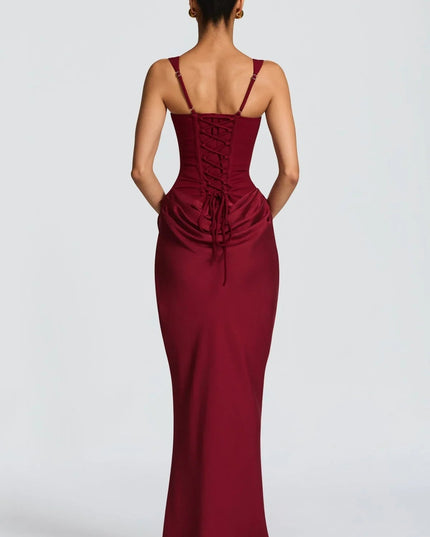 Back view of the burgundy square neck corset maxi dress, highlighting the adjustable lace-up back closure.