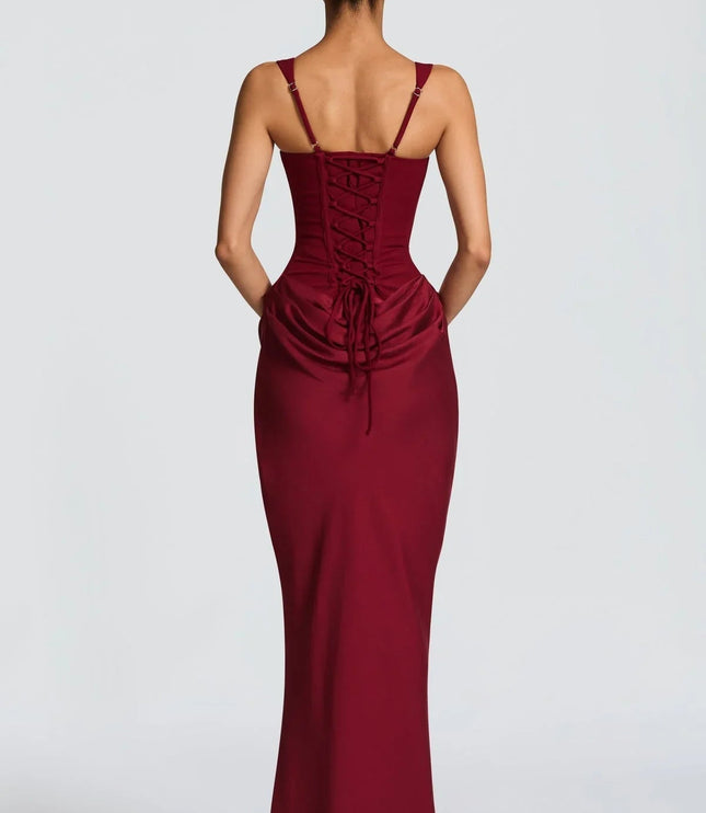 Back view of the burgundy square neck corset maxi dress, highlighting the adjustable lace-up back closure.