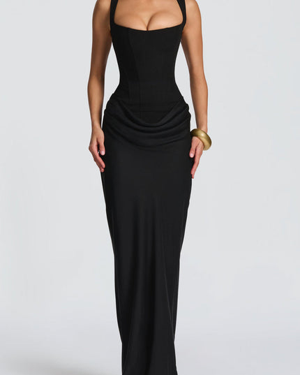 Full-length front view of the black square neck draped corset maxi dress, emphasizing the long, flowing skirt.