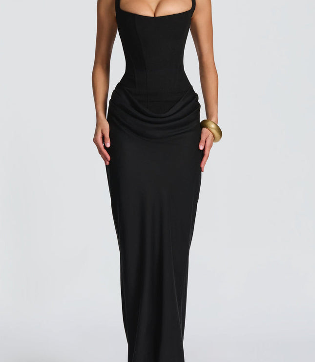 Full-length front view of the black square neck draped corset maxi dress, emphasizing the long, flowing skirt.