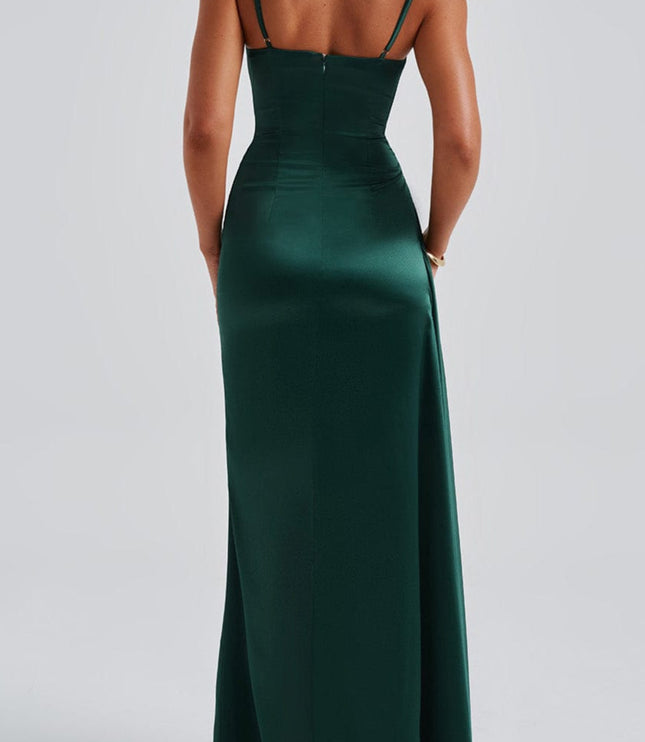 Back view of the deep green satin dress, showing the straight back and full-length skirt.